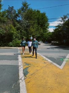 Models walking across street with Cape Cod sweatshirts